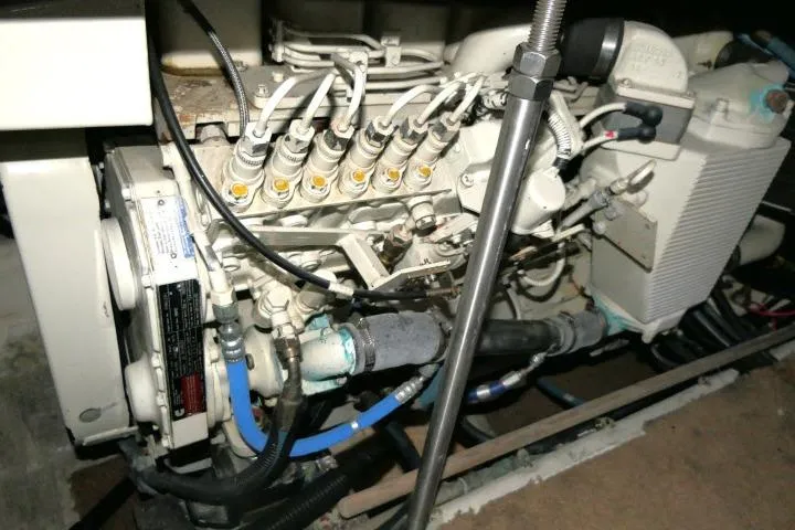 Slide: The Image of Engine compartment of a 2000 Carver 406 Motor Yacht, showcasing mechanical components. - 30