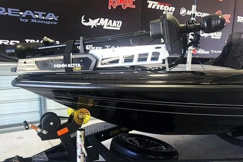 Slide: The Image of 2026 Triton 18 TrX boat with Minn Kota Ultrex motor on display. - 10