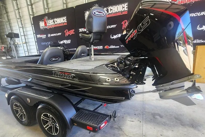 Slide: The Image of 2026 Triton 18 TrX boat with Mercury Pro XS engine in showroom. - 6