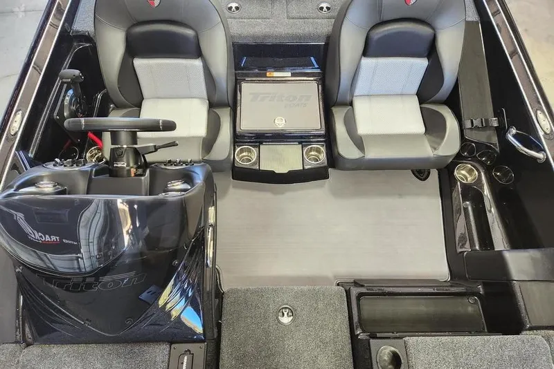 Slide: The Image of Interior of 2026 Triton 18 TrX boat with dual seats and steering console. - 8