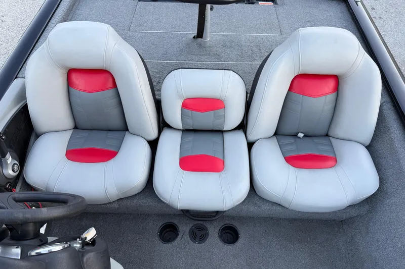 Slide: The Image of 2017 Tracker Pro Team 175 boat interior with gray and red cushioned seats. - 25