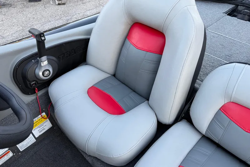 Slide: The Image of 2017 Tracker Pro Team 175 boat interior with gray and red seating. - 26