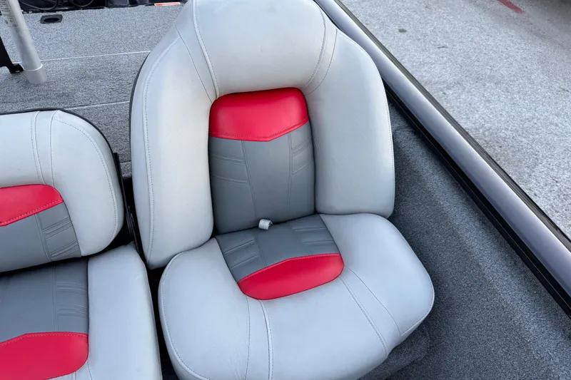 Slide: The Image of 2017 Tracker Pro Team 175 boat seat with gray and red upholstery. - 28