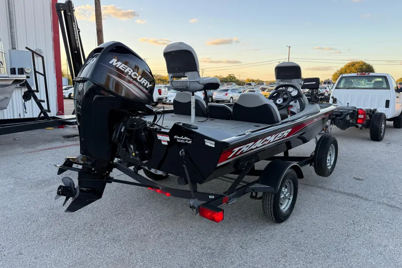Slide: The Image of 2017 Tracker Pro Team 175 boat with Mercury engine on trailer in parking lot. - 3