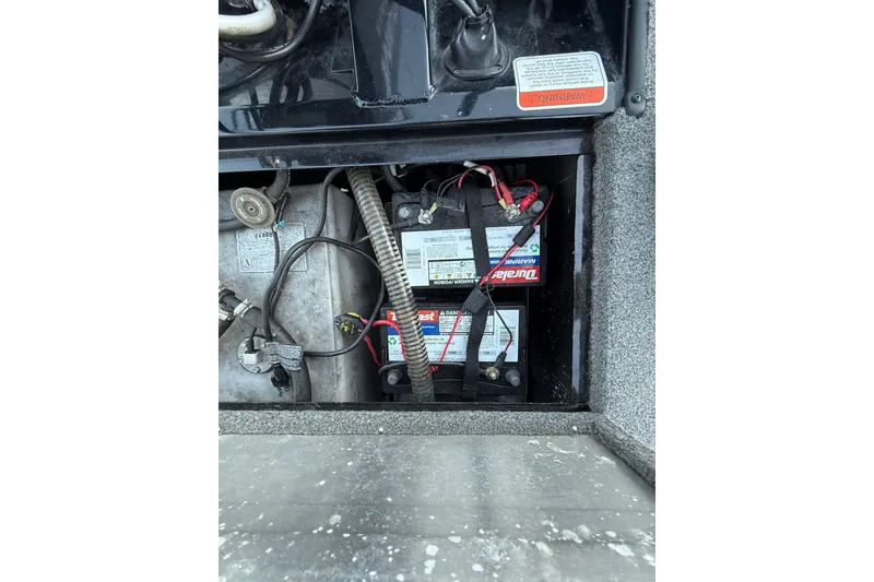 Slide: The Image of 2017 Tracker Pro Team 175 boat battery compartment with wiring and components. - 36