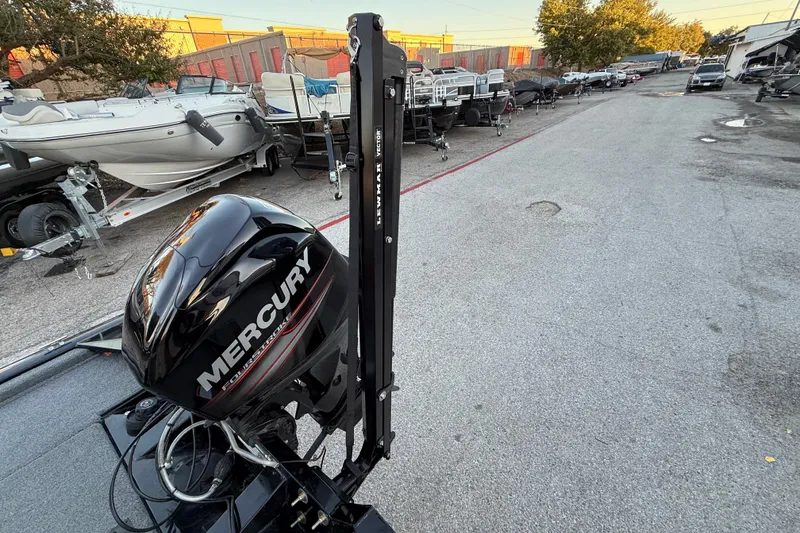 Slide: The Image of 2017 Tracker Pro Team 175 with Mercury engine in a boatyard setting. - 37