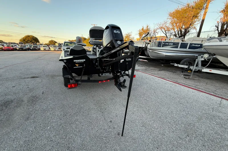 Slide: The Image of 2017 Tracker Pro Team 175 boat with Mercury engine in a parking lot. - 39