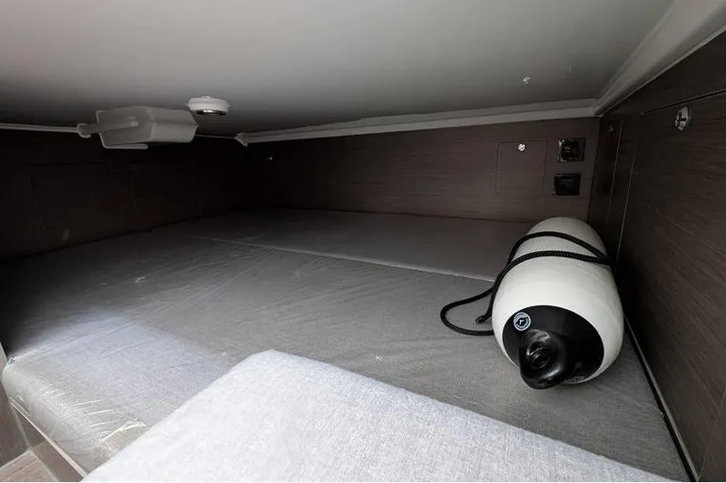 Slide: The Image of 2024 Beneteau Flyer 9 SPACEdeck cabin interior with storage and fender. - 15