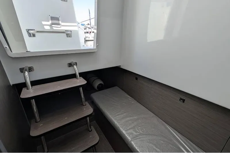 Slide: The Image of 2024 Beneteau Flyer 9 SPACEdeck cabin interior with steps and seating area. - 16