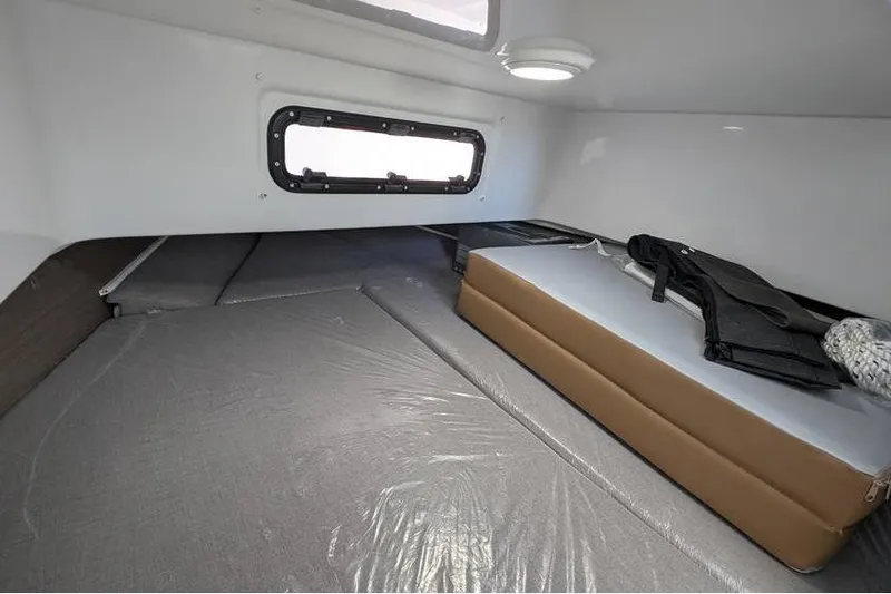 Slide: The Image of 2024 Beneteau Flyer 9 SPACEdeck cabin interior with bed and window. - 17