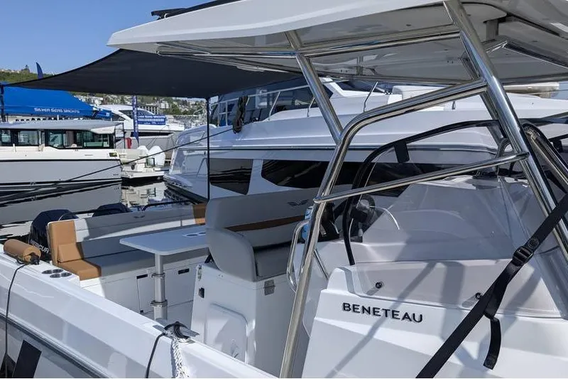 Slide: The Image of 2024 Beneteau Flyer 9 SPACEdeck boat at marina, featuring sleek design and spacious deck. - 7