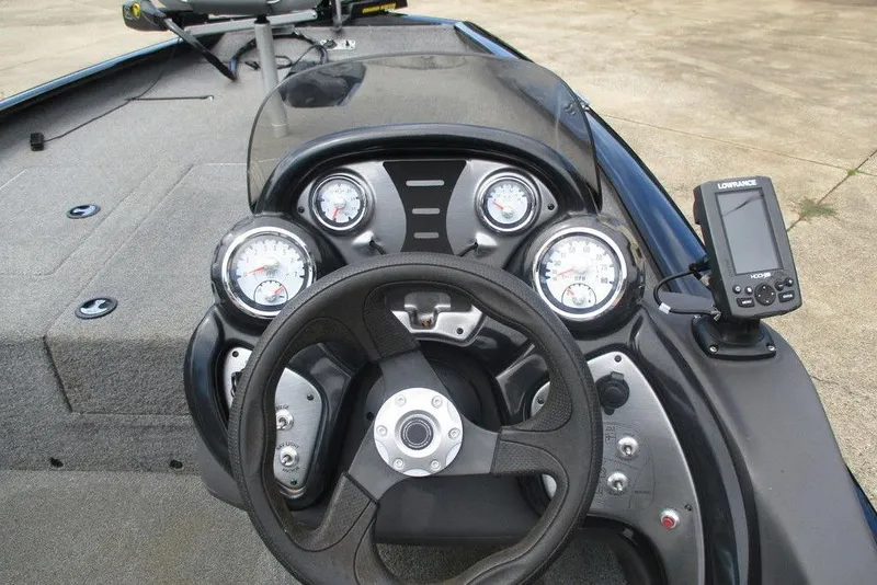 Slide: The Image of 2018 Tracker Pro Team 175 TXW boat dashboard with steering wheel and gauges. - 6