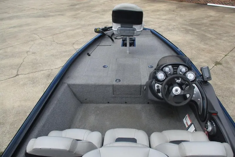 Slide: The Image of 2018 Tracker Pro Team 175 TXW boat interior with steering console and seating. - 7