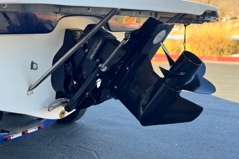 Slide: The Image of 2006 Bayliner 215 Bowrider with MerCruiser outdrive, close-up view. - 7