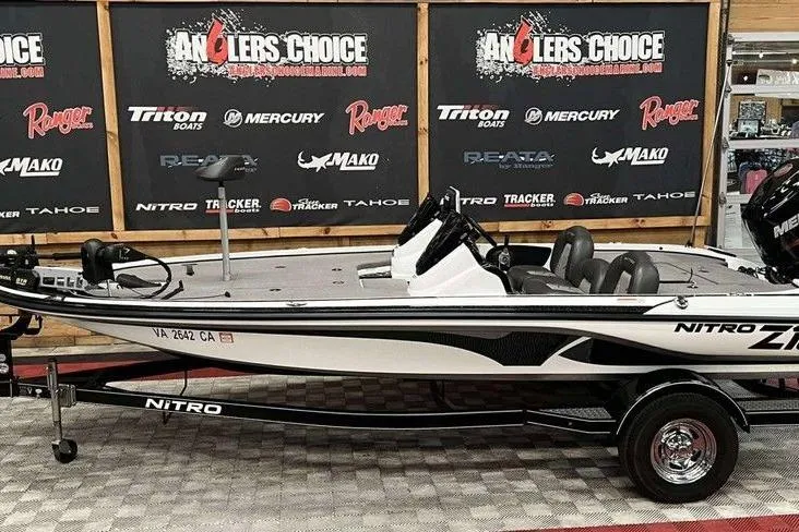 The Image of 2016 Nitro Z18 boat displayed at Anglers Choice event with branded backdrop. - 1