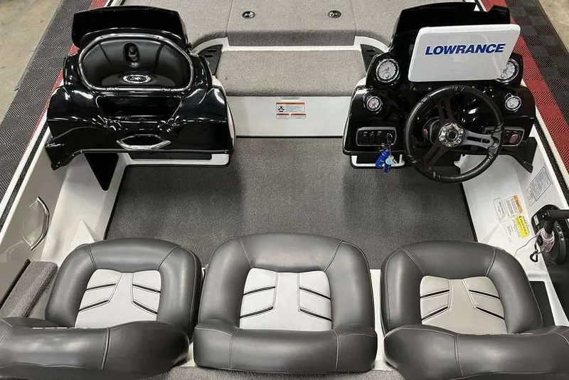 Slide: The Image of Interior of a 2016 Nitro Z18 boat with steering wheel and seating. - 7
