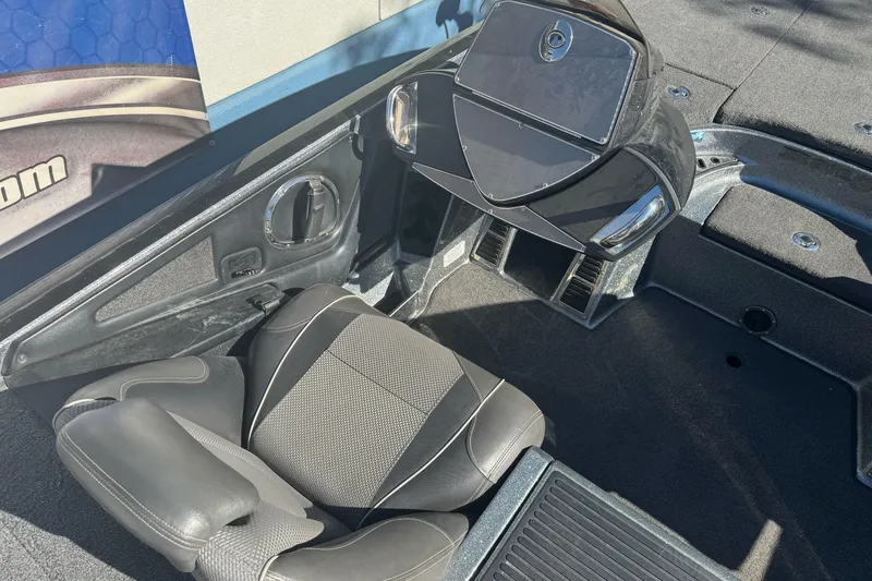 Slide: The Image of 2020 Ranger Z521C Ranger Cup Equipped boat interior with black seating and dashboard. - 11