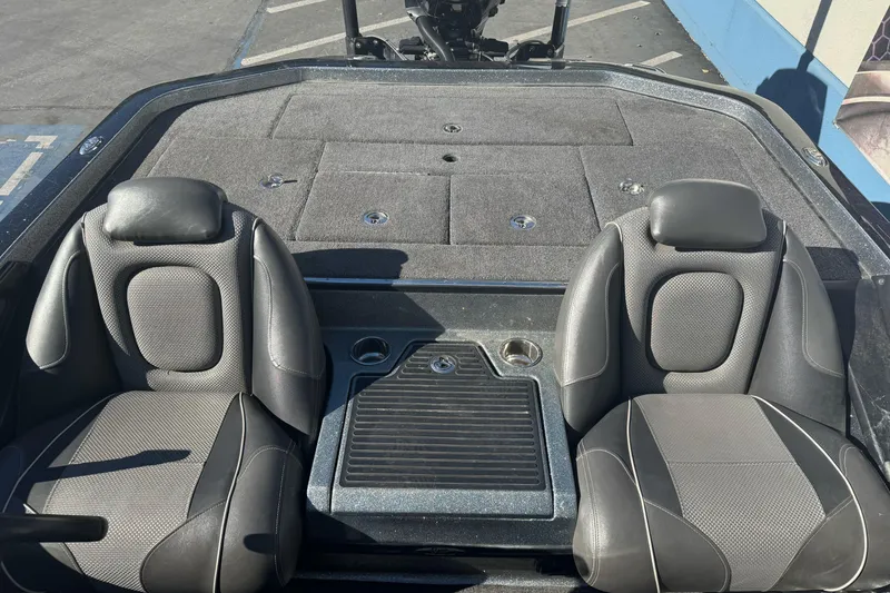 Slide: The Image of 2020 Ranger Z521C Ranger Cup boat interior with dual seats and storage compartments. - 12
