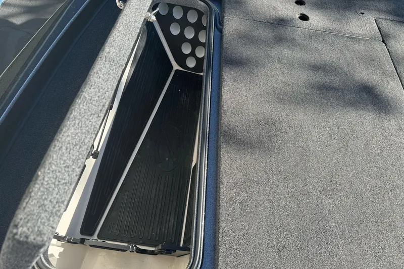 Slide: The Image of 2020 Ranger Z521C Ranger Cup Equipped boat storage compartment, open with carpeted interior. - 18