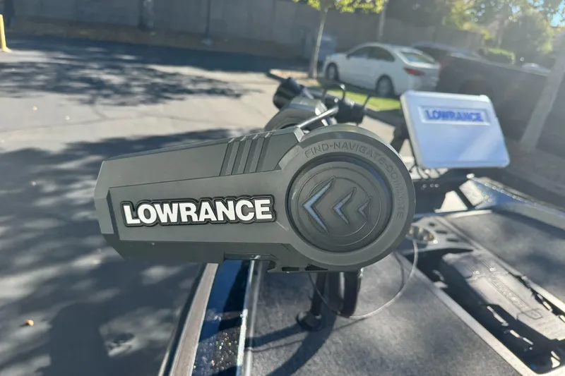 Slide: The Image of 2020 Ranger Z521C boat with Lowrance navigation equipment in a parking lot. - 21