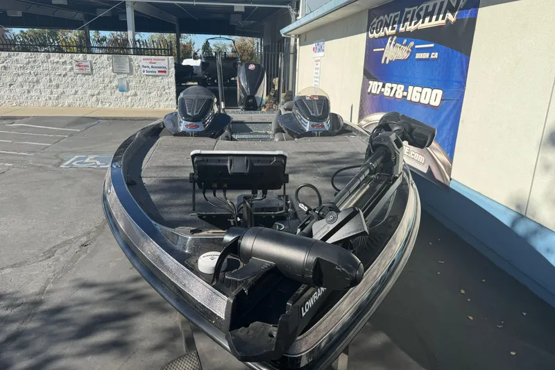 Slide: The Image of 2020 Ranger Z521C Ranger Cup Equipped boat with advanced fishing gear in a dealership lot. - 4