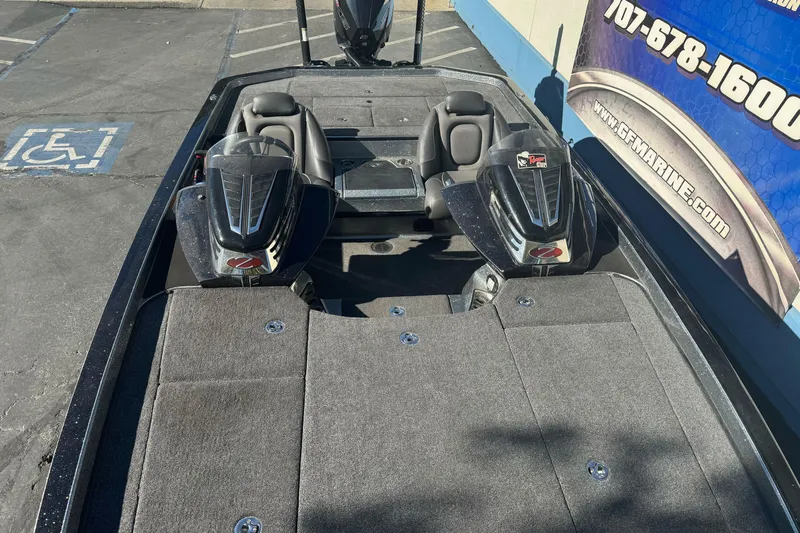 Slide: The Image of 2020 Ranger Z521C Ranger Cup Equipped boat, dual seats, parked near a marine store. - 7