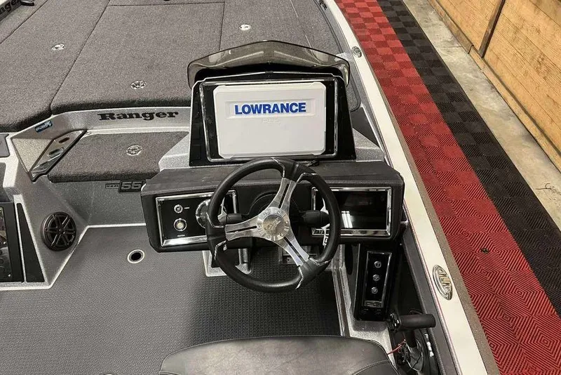 Slide: The Image of 2023 Ranger Z520R boat cockpit with Lowrance display and steering wheel. - 7