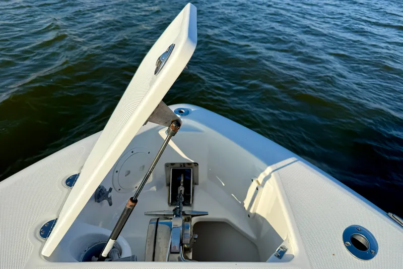 Slide: The Image of Open hatch on 2008 Everglades 350 Center Console boat, revealing anchor storage. - 12
