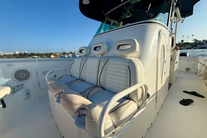 Slide: The Image of 2008 Everglades 350 Center Console boat interior with cushioned seating and ocean view. - 17
