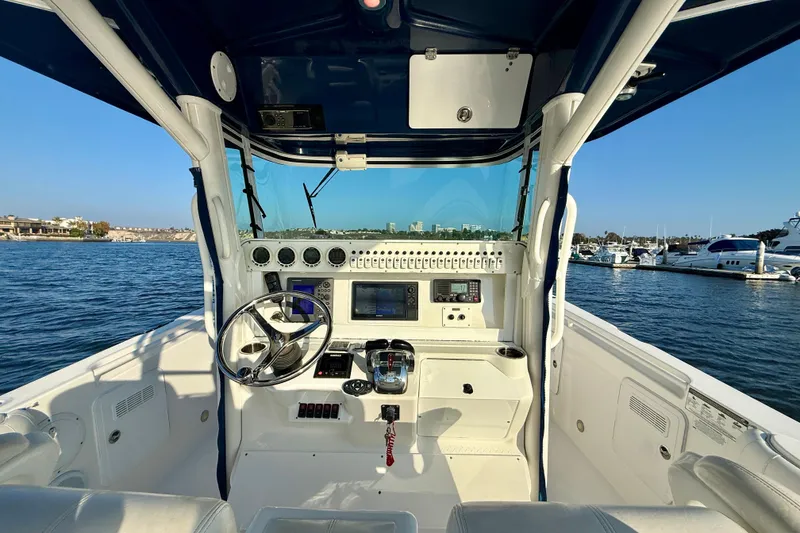 Slide: The Image of 2008 Everglades 350 Center Console boat interior with steering wheel and control panel. - 29