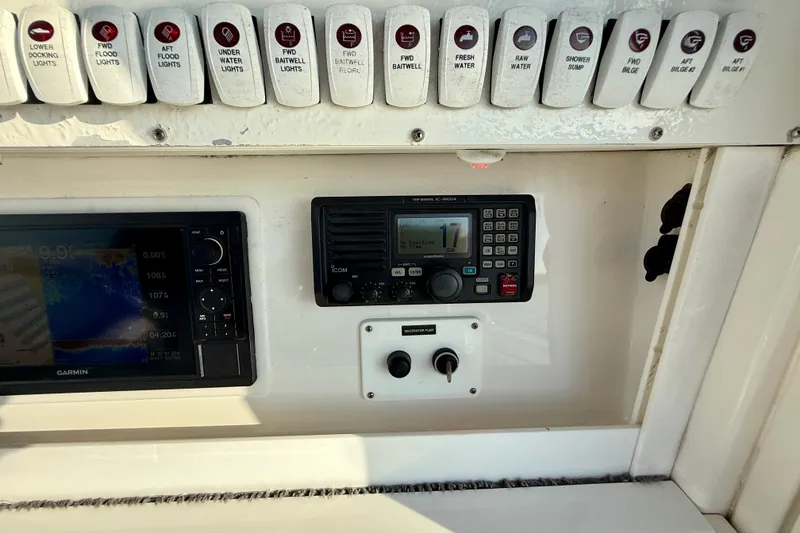 Slide: The Image of Control panel of a 2008 Everglades 350 Center Console boat with Garmin and Icom devices. - 31