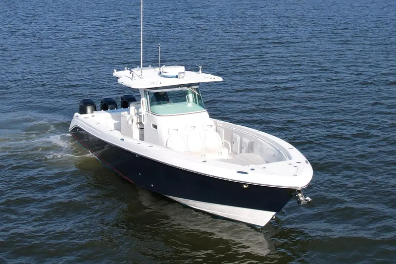 Slide: The Image of 2008 Everglades 350 Center Console boat cruising on open water. - 4