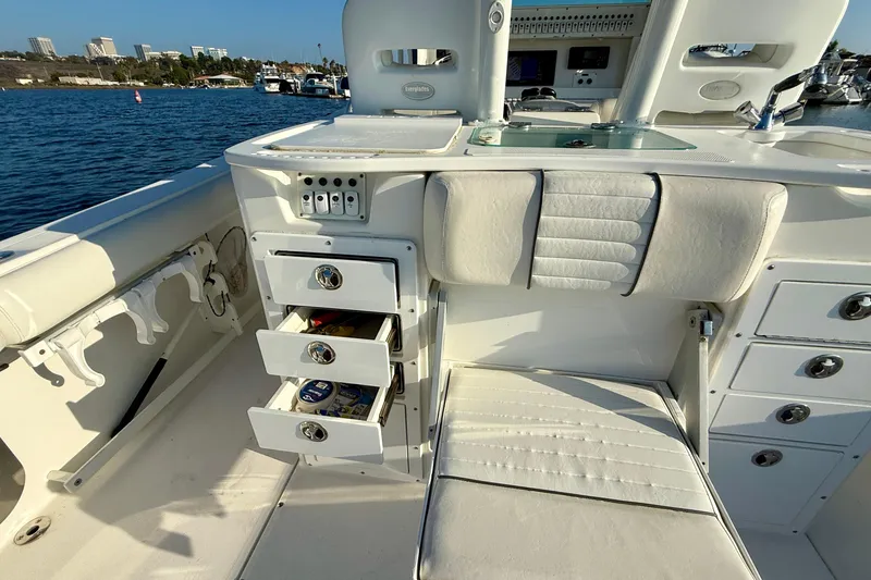 Slide: The Image of 2008 Everglades 350 Center Console boat interior with storage drawers and seating. - 45