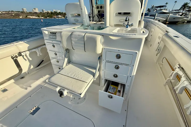 Slide: The Image of 2008 Everglades 350 Center Console boat interior with seating and storage drawers. - 46
