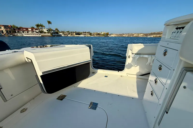 Slide: The Image of 2008 Everglades 350 Center Console boat interior with ocean view and coastal backdrop. - 51
