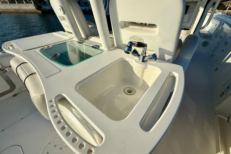 Slide: The Image of 2008 Everglades 350 Center Console boat with sink and faucet on deck. - 56