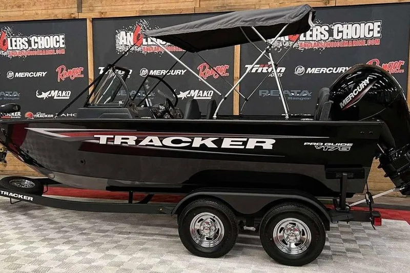 The Image of 2026 Tracker Pro Guide V-175 Combo boat on display with Mercury engine. - 1