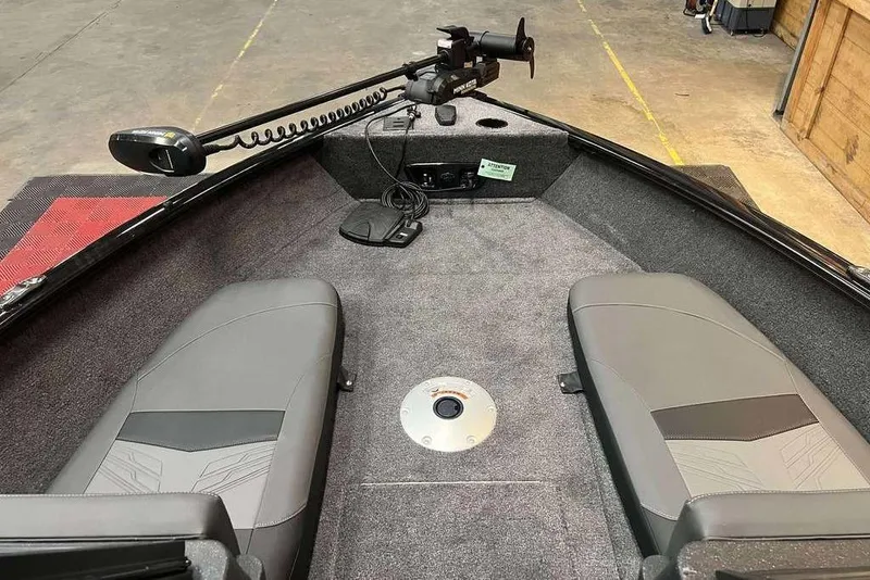 Slide: The Image of 2026 Tracker Pro Guide V-175 Combo boat interior with seating and trolling motor. - 10