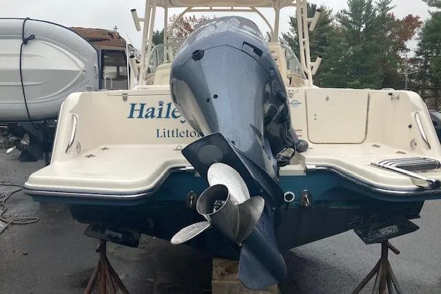 Slide: The Image of 2020 Grady-White Freedom 235 boat with outboard motor, parked on a trailer. - 8