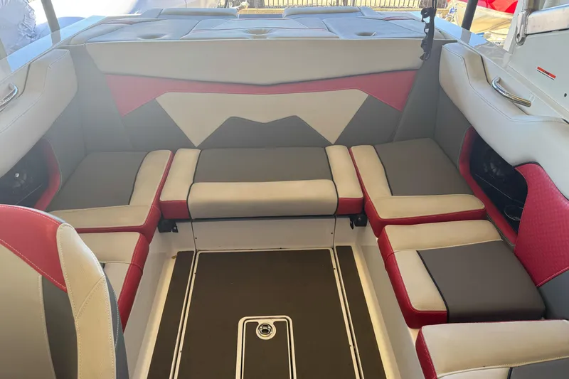 Slide: The Image of Open storage compartment in 2023 Supreme ZS212 boat, featuring a clean white interior. - 10