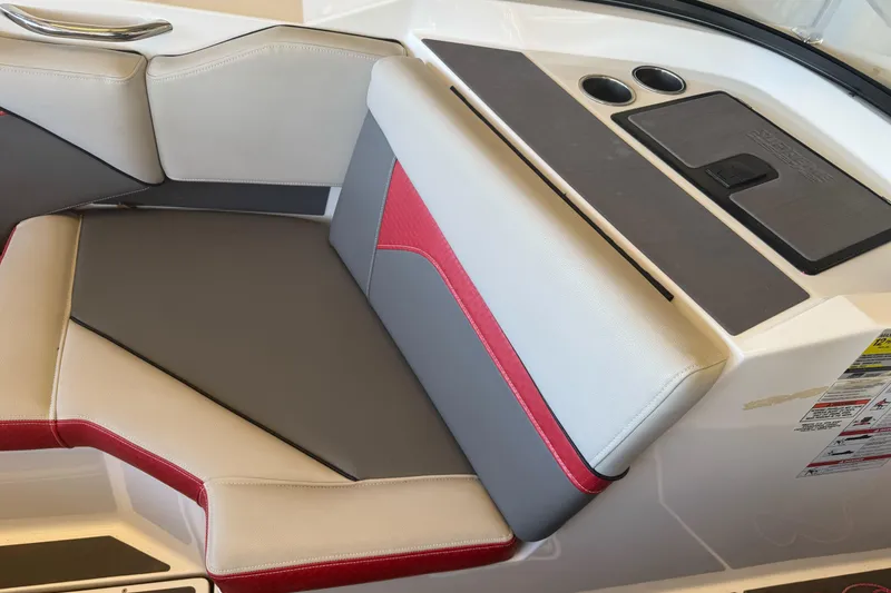 Slide: The Image of 2023 Supreme ZS212 boat storage compartment, open lid, white interior with black trim. - 11