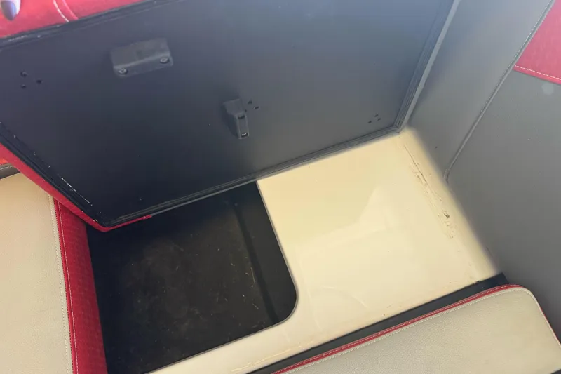 Slide: The Image of 2023 Supreme ZS212 boat dashboard with steering wheel and control panel. - 14