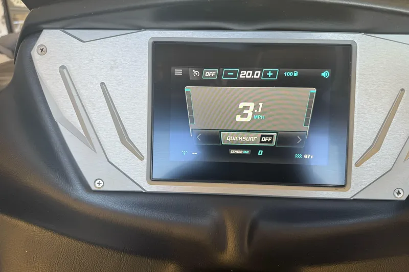 Slide: The Image of 2023 Supreme ZS212 boat interior with red and gray seating, cup holders, and speaker. - 19