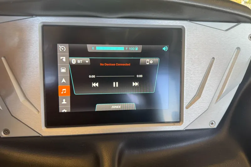 Slide: The Image of 2023 Supreme ZS212 boat interior storage compartment with red and gray seating. - 21