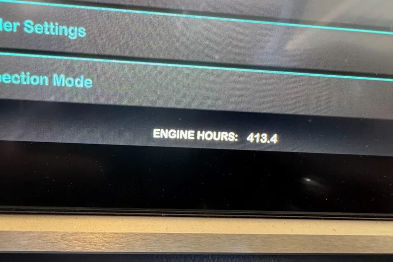 Slide: The Image of 2023 Supreme ZS212 boat storage compartment with tools and wiring. - 23