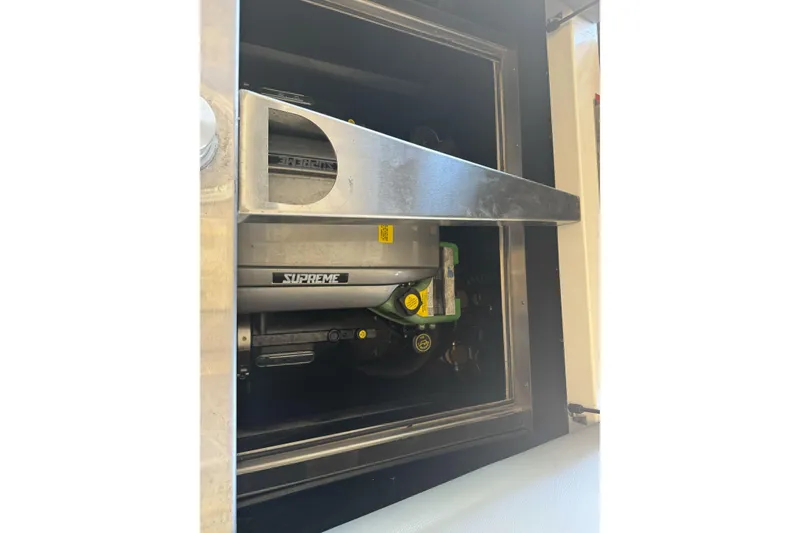 Slide: The Image of 2023 Supreme ZS212 boat interior with gray and red seating, steering wheel, and control lever. - 28