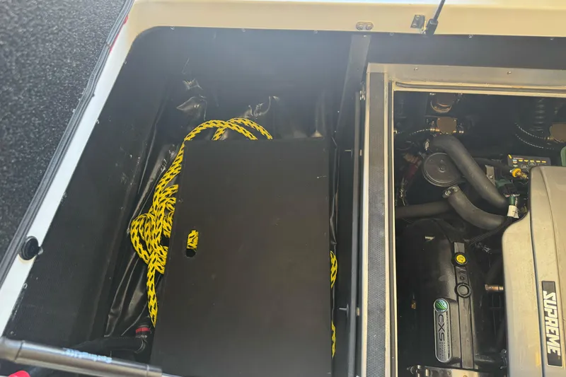 Slide: The Image of 2023 Supreme ZS212 boat interior with red and gray seating and steering wheel. - 29