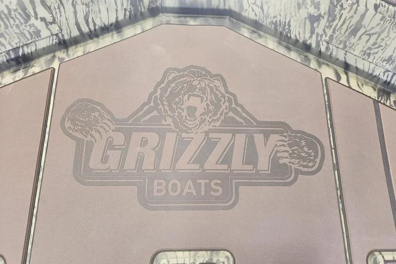 Slide: The Image of Tracker Grizzly 2072 CC 2026 boat deck with Grizzly Boats logo design. - 12