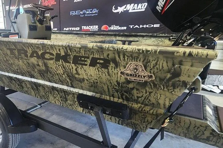 Slide: The Image of 2026 Tracker Grizzly 2072 CC boat with camouflage design on display. - 3