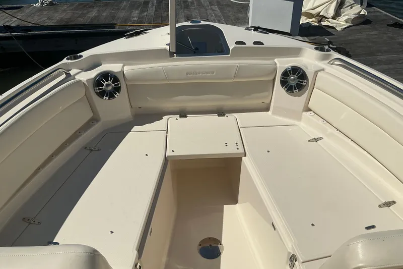 Slide: The Image of 2020 Grady-White Freedom 285 boat interior with spacious seating and speakers. - 21